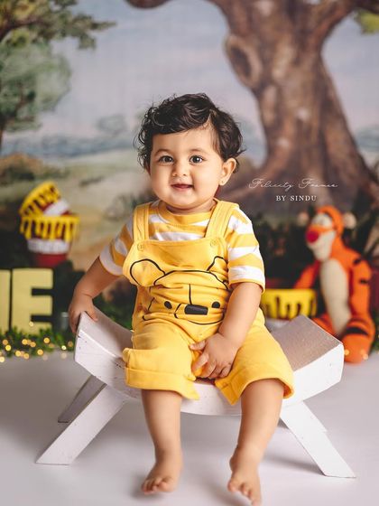 A trip to the Hundred Acre Wood for this little one's milestone session. The Winnie the Pooh theme is a timeless classic for a reason.