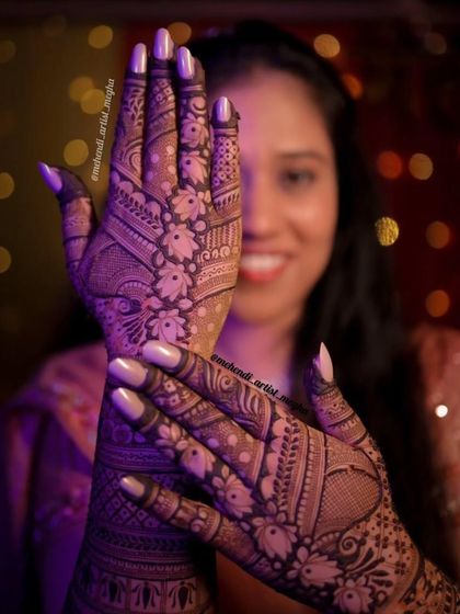A beautiful portrait-style shot showing a full-coverage floral design, with the client's happy face blurred in the background.
