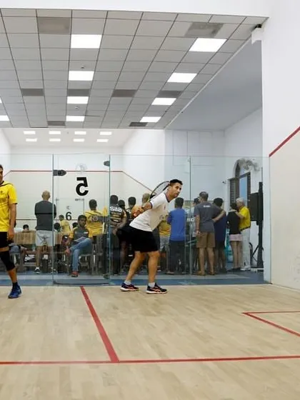A full house watching the intense final match. We cultivate an atmosphere where the crowd's energy fuels the players on the court.