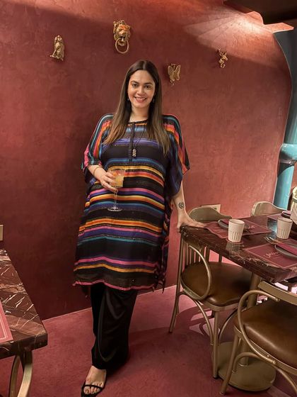I'm a big believer in shopping your own closet. I bought this quirky Manish Arora kurta a decade ago, and it still feels fresh and relevant. It's a great example of sustainable fashion and timeless design.