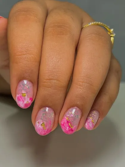 This is an inbuilt overlay on natural nails. I created a pink marble effect with encapsulated gold foil and glitter to add strength and style without adding length.