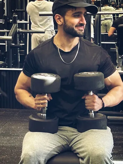Strength isn't just about lifting weights; it's about lifting yourself up every day. Here I am with a set of heavy dumbbells, ready for a chest press session.