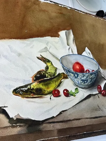 The still life of fish and cherries on my easel. Seeing the work in progress helps students understand the setup and process.
