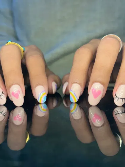 A dreamy and cute design with hand-painted rainbows, hearts, stars, and sleeping eyelashes on a nude base.