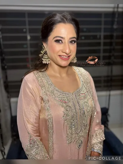 A smiling portrait showing the front view of this elegant half-up style. It keeps the hair off the face while showcasing the beautiful curls.