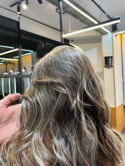 A close-up showing the fine ash blonde babylights. This technique is perfect for a very natural, sun-kissed effect.