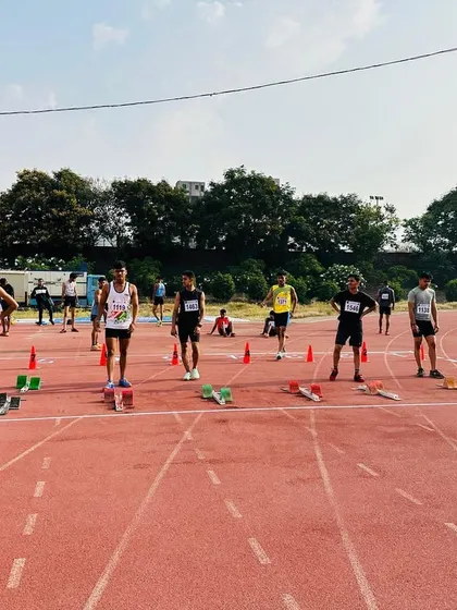 At the starting line, anticipation brims as athletes get ready for the race.