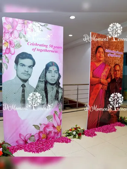 A heartfelt "then and now" photo display celebrating 50 years of togetherness. Large vertical banners showcase photos of the couple from their wedding day and the present, creating a beautiful tribute to their journey.