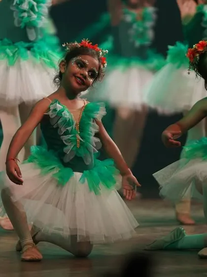 The mystical flora dancers in a graceful pose. Their movements are designed to be ethereal and enchanting, like a magical forest come to life.