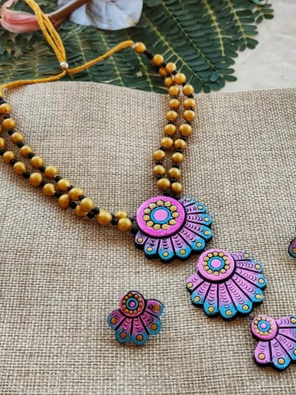 Here is the same three-layer floral necklace in a baby pink and sky blue combination. The soft pastel colors make it a very pretty and feminine piece.