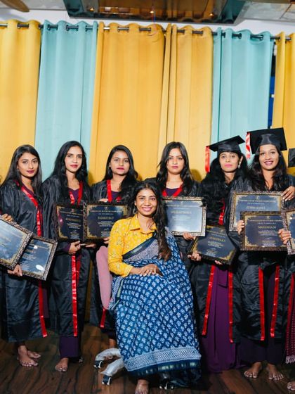 The full graduating class, proudly displaying their certificates.