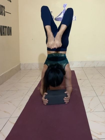 Using a block between my forearms for a headstand. This is a great technique to ensure shoulder stability and prevent injury.