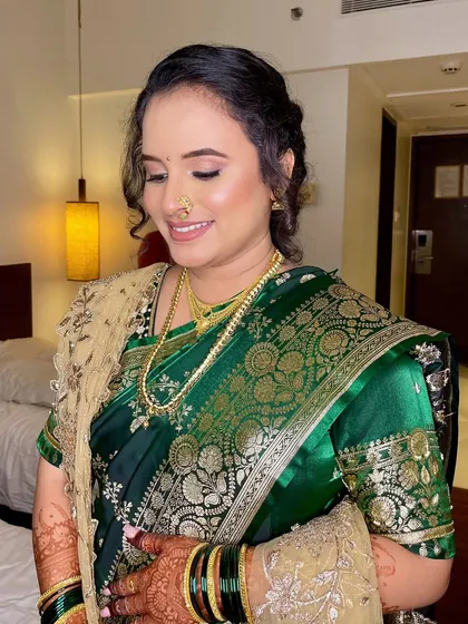 A close-up of the bride's soft, elegant makeup. The eyeshadow is blended seamlessly, and her skin has a beautiful, natural-looking glow.