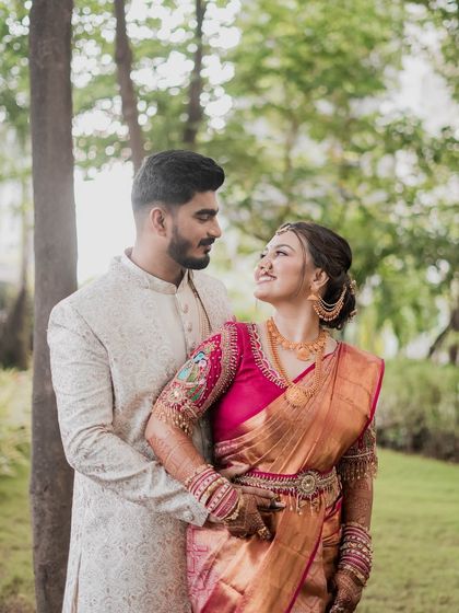 An intimate portrait surrounded by nature. The bride's glowing makeup and traditional Kanjivaram saree look absolutely breathtaking.