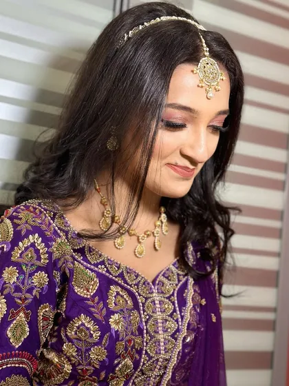 A sweet and adorable look for a younger client, perfect for a family wedding. The makeup is kept fresh, minimal, and age-appropriate, with a touch of shimmer on the eyes.