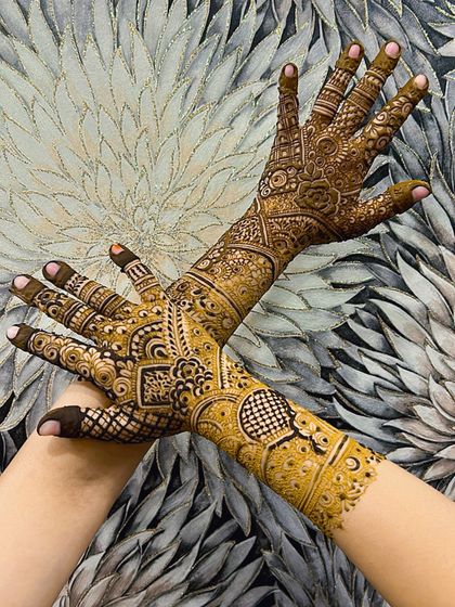 A crossed-hands pose highlighting the beautiful flow and symmetry of the design.