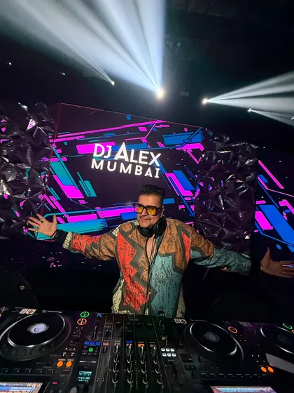 In my element, commanding the stage at a massive corporate gig for HSBC at NESCO. The lights, the sound, the massive LED backdrop, and me at the center of it all. This image captures the scale and professionalism I bring to every large-scale event.