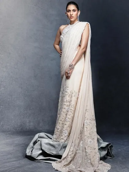 This custom Tamara Ralph saree redefines elegance with its modern drape and delicate embroidery. It’s an ethereal and sophisticated choice for a cocktail party or a formal reception, proving that sarees can be contemporary and chic.