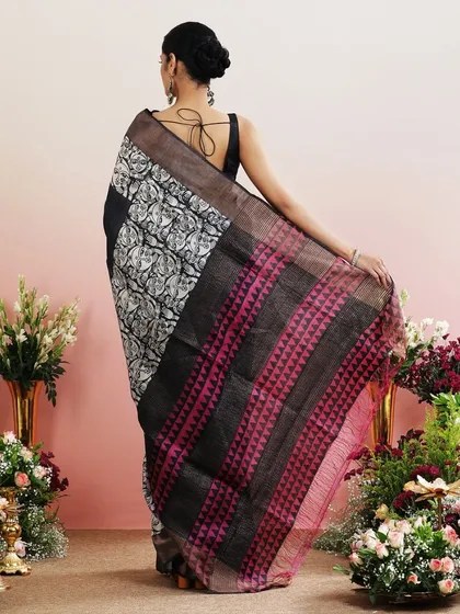 The back view of the graphic print saree, showing the interesting play of patterns and colors.