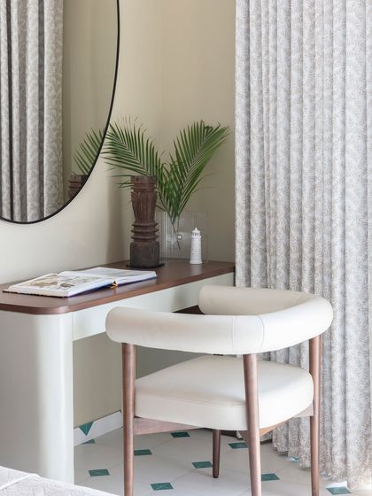 Amidst the tranquil sanctuary of this bedroom lies a wondrous alcove. I designed this cozy study corner to be a space where creativity blossoms and dreams take flight, anchored by a simple desk and a comfortable chair.