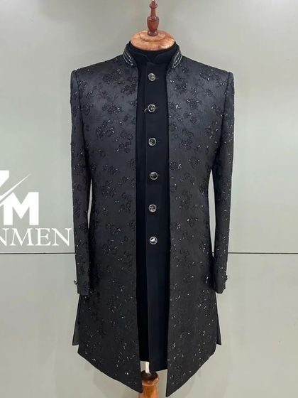 A timeless black Indo-Western sherwani with subtle, all-over floral embroidery in a tonal thread. A classic and elegant choice for any formal occasion.
