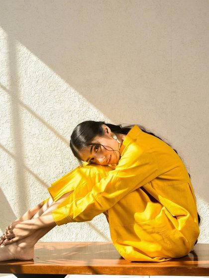 A sunlit portrait for Shipra Shroff, using natural light play in our studio to create a warm and joyful image.