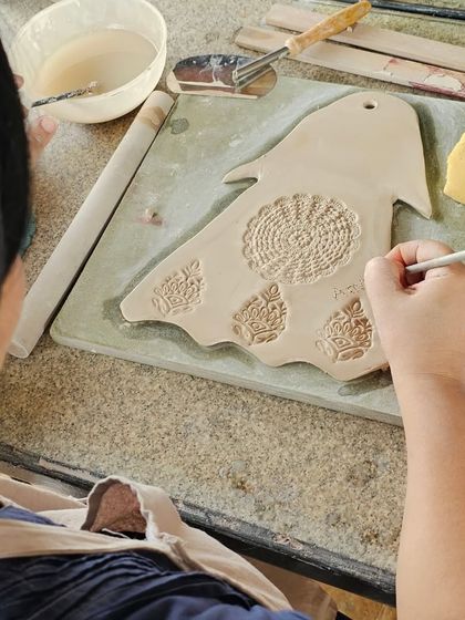 A few snapshots of corporate team members completely absorbed in their creative process. They are making everything from decorative nameplates to unique bowls during our hand-building workshop.