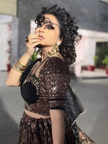 A dramatic pose in my wedding guest lehenga. The combination of the traditional print with a modern blouse cut is what makes this look special.