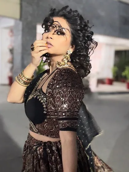 A dramatic pose in my wedding guest lehenga. The combination of the traditional print with a modern blouse cut is what makes this look special.