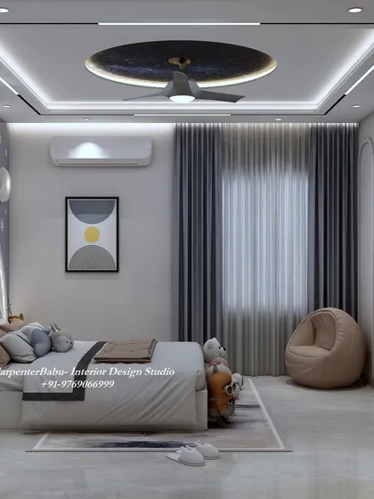This view shows the other side of the room, with a cozy beanbag and a simple, modern art print. The false ceiling features a stunning galaxy-themed light.