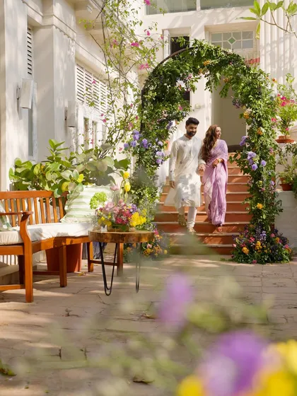 For Oishi and Arpit's Haldi, we created a sun-drenched Spanish courtyard. The couple's entrance through a blooming floral arch set the tone for a day filled with natural beauty, vibrant color, and effortless joy.