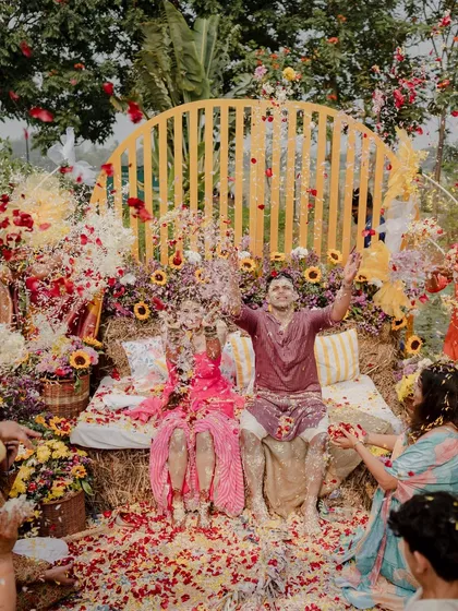 A Haldi ceremony is all about unrestrained joy. We created a vibrant, sun-drenched setting with hay bale seating and a backdrop of sunflowers, which became the perfect stage for this unforgettable flower shower, capturing the pure, unfiltered happiness of the moment.