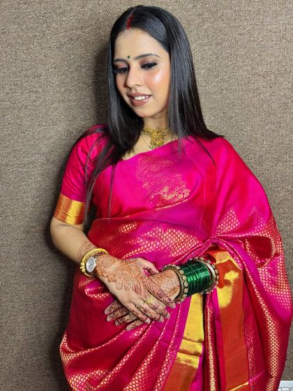A beautiful client in a bright pink saree. I created a soft, glowing makeup look for her.