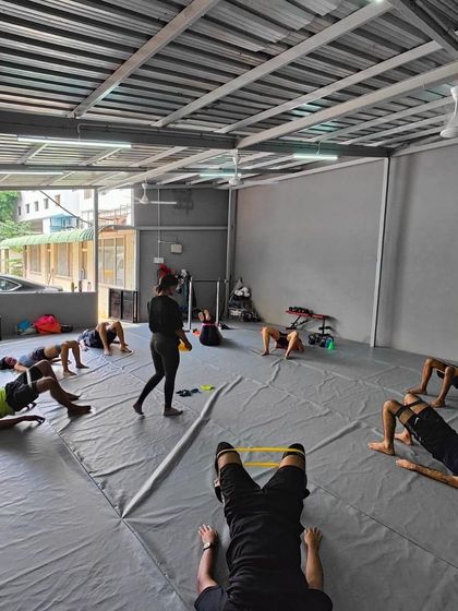 Another view of our crew working on their glute activation during a weekend session.