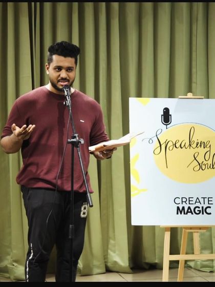 An artist passionately performing his piece for the "Speaking Souls" community.