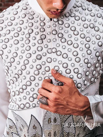 The pearl lotus motif, a symbol of power and purity, brought to life with intricate hand-embroidery on a modern Indian silhouette. This detail shot shows the fusion of traditional symbolism with contemporary couture techniques, a hallmark of my work.