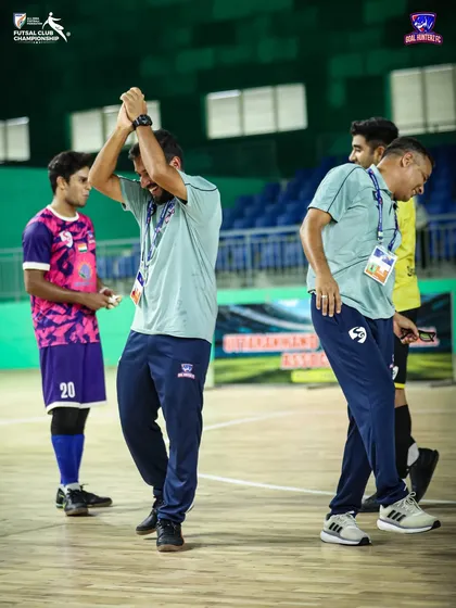 The coaches dancing with joy after a successful semi-final.