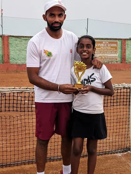 Trisha Bhosale with her coach after winning the AITA Championship Series Under 12 tournament in Sonipat.
