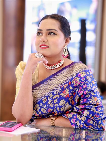 Lost in thought while hosting. A saree is one of the most elegant outfits for an Indian event, and this blue one is a personal favorite.