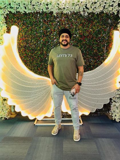 Ready for Day 1 of a big Punjabi wedding celebration, starting with the engagement and cocktail party. The angel wings decor sets a great mood.