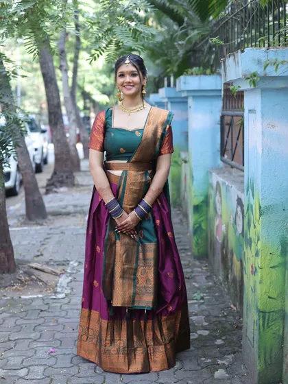 A smiling portrait. The client looks happy and beautiful in her traditional attire.