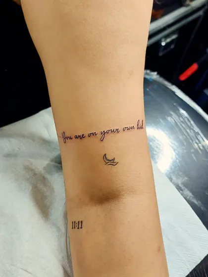The quote "you are on your own kid" paired with a tiny wave and the number 11:11. A beautiful combination of meaningful text and symbols.