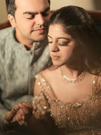 A quiet, romantic portrait of the couple, their eyes closed, capturing a moment of serene connection.