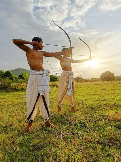 The journey of Dhanurvidya is a reflection of self-mastery. Here, two young archers practice in unison, their forms mirroring each other as they progress on the path to becoming warriors of the mind and body.