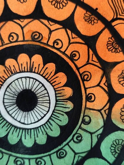 A close-up of the tricolor mandala, showing the detailed patterns made with a Brustro pigment liner.