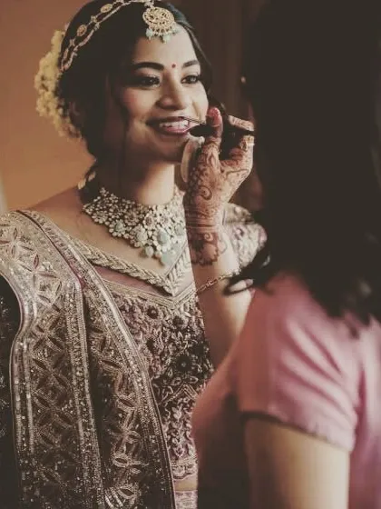 A behind-the-scenes look at the final lip touch-up, ensuring a long-lasting and perfect pout for the entire ceremony.