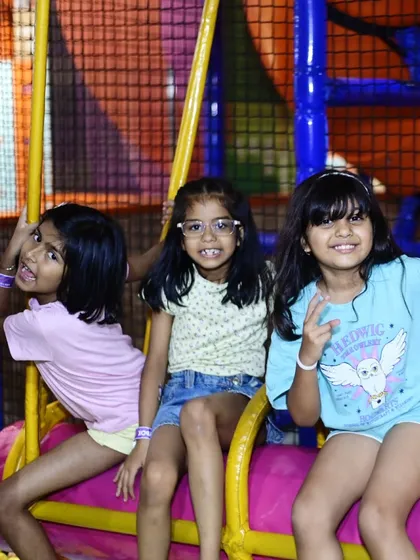 Friends hanging out on the swinging log ride. It's a great place to chat and play at the same time.