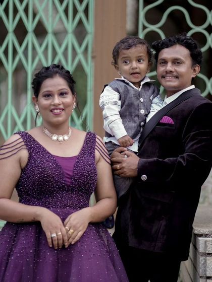 An identical shot of the family in purple, capturing a warm and happy moment together.