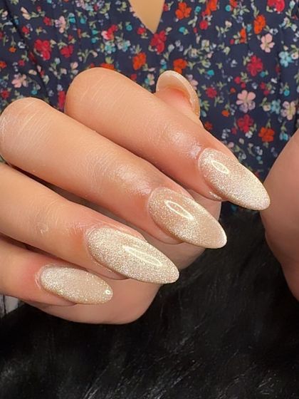 Stunning champagne gold cat eye nails for an engagement, a perfect celebratory look.
