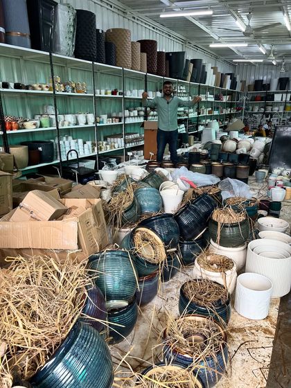 Another shot of the organized chaos when a new shipment arrives. This is where the magic begins, as we prepare thousands of new ceramic pots for you to choose from.